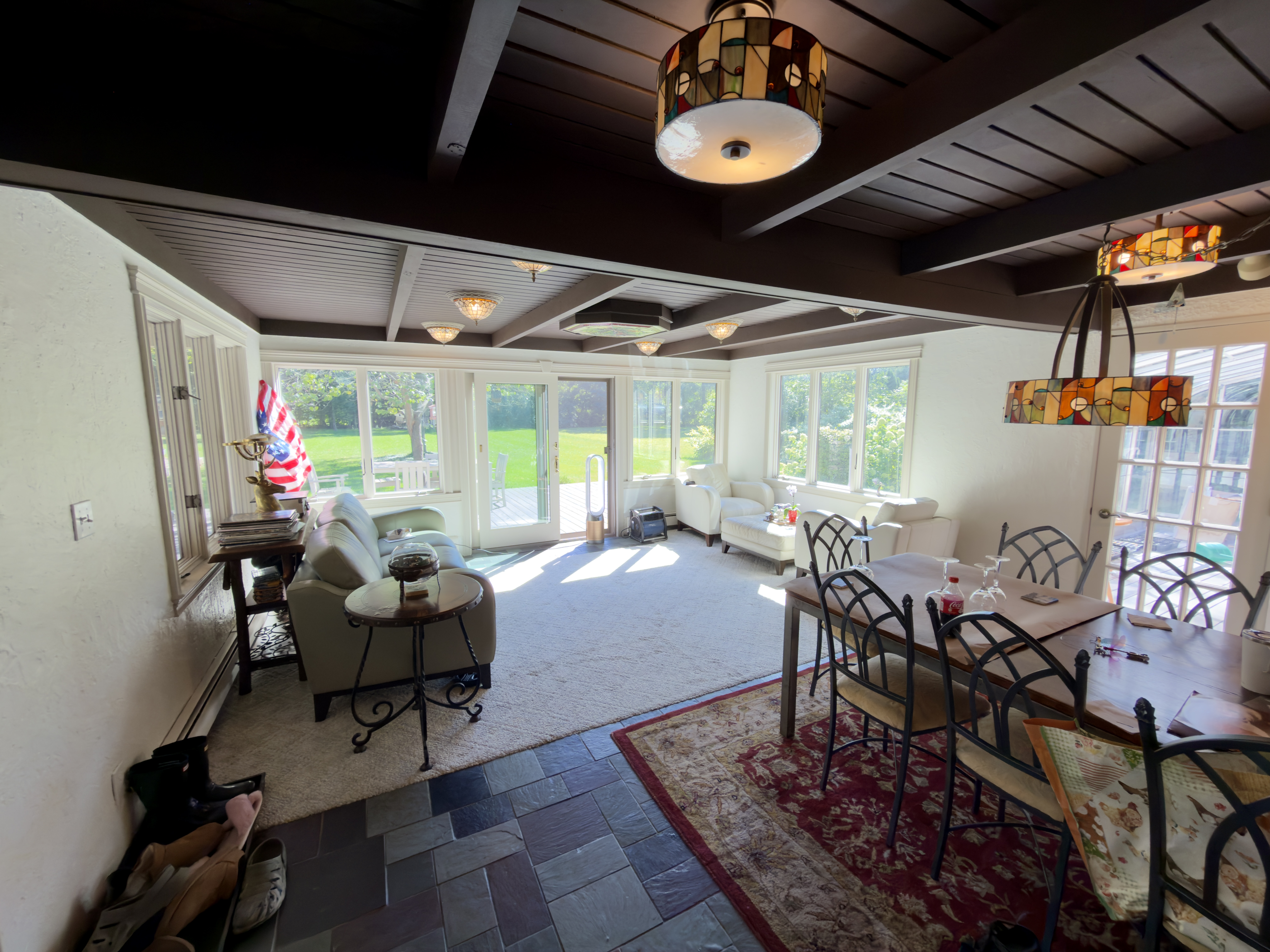 QOQ interior painting project with freshly painted light walls, trim and windows beneath existing dark ceiling beams